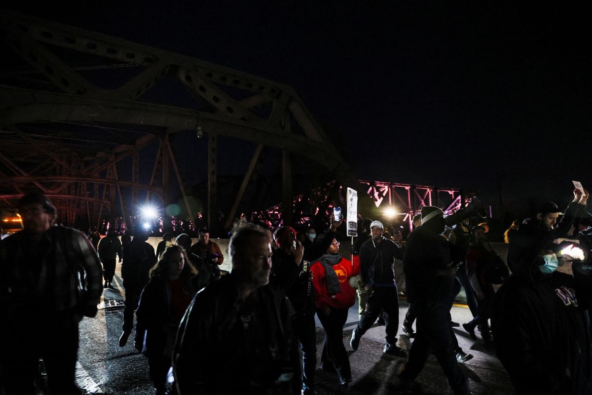 People gather on the day of the release of a video showing police officers beating Tyre Nichols, the young Black man who was killed during a traffic stop by Memphis police officers, in downtown Memphis, Tennessee, U.S., January 27, 2023. REUTERS/Leah Millis