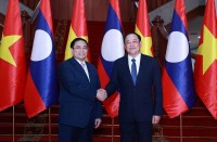 Thủ tướng Phạm Minh Chính gặp Thủ tướng Lào Sonexay Siphandone