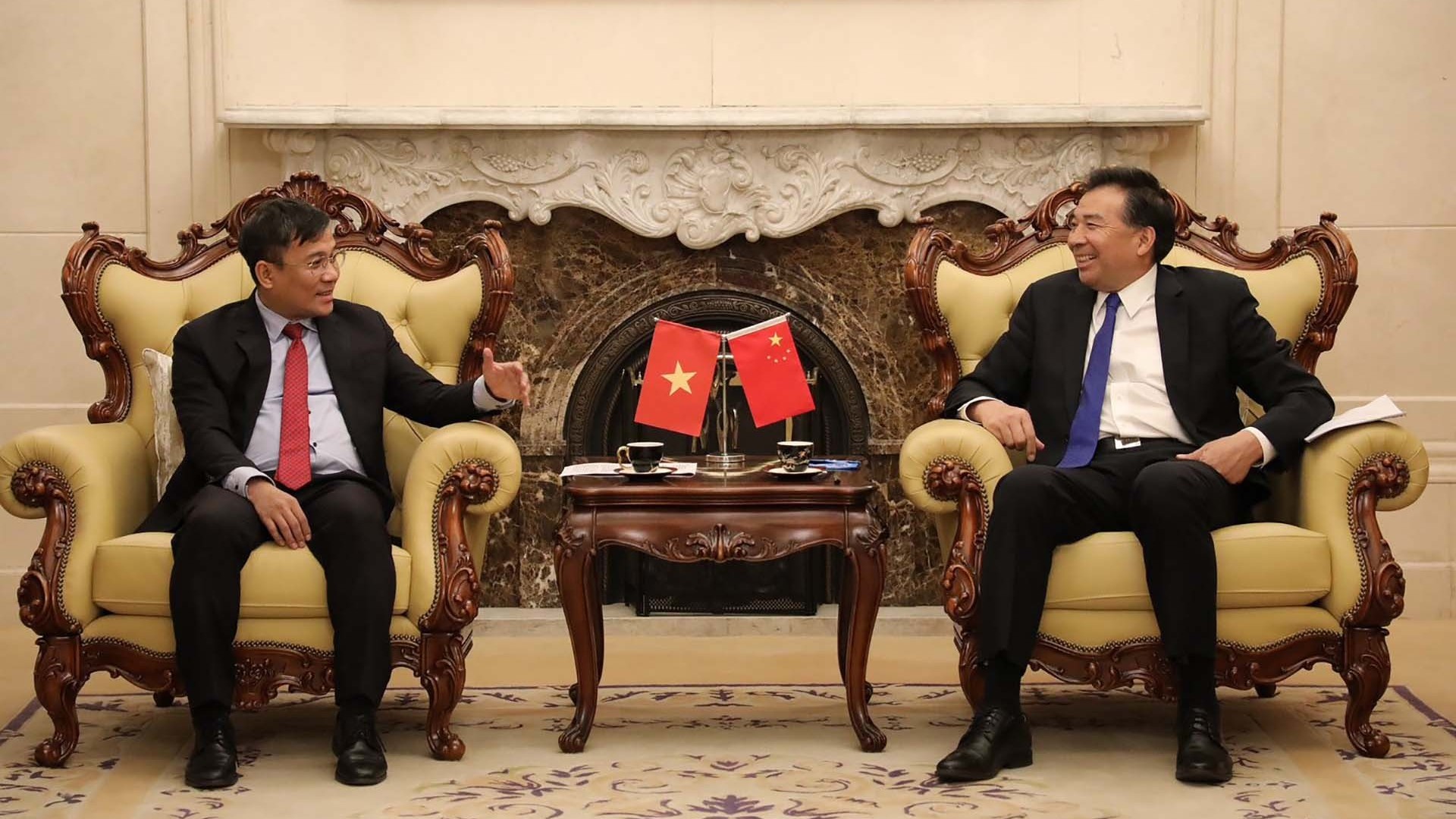 Thứ trưởng Thường trực Bộ Ngoại giao Nguyễn Minh Vũ hội kiến Tổng Cục trưởng Hợp tác phát triển quốc tế quốc gia Trung Quốc