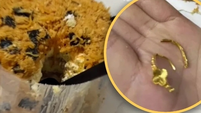 Cô gái cắn vỡ nhẫn cầu hôn do bạn trai đặt trong chiếc bánh ngọt