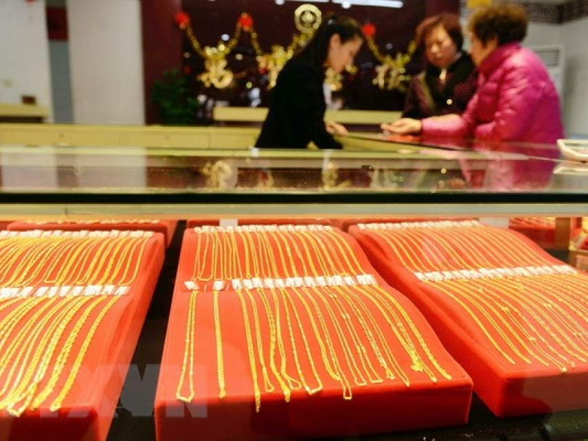 ​Giá vàng thế giới xác lập "đáy" mới trong năm 2018