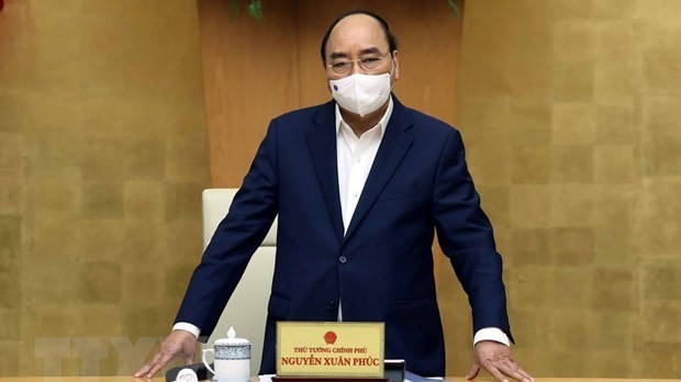 Thủ tướng yêu cầu nhanh chóng tổ chức tiêm vaccine ngừa Covid-19, gỡ ách tắc lưu thông hàng hóa