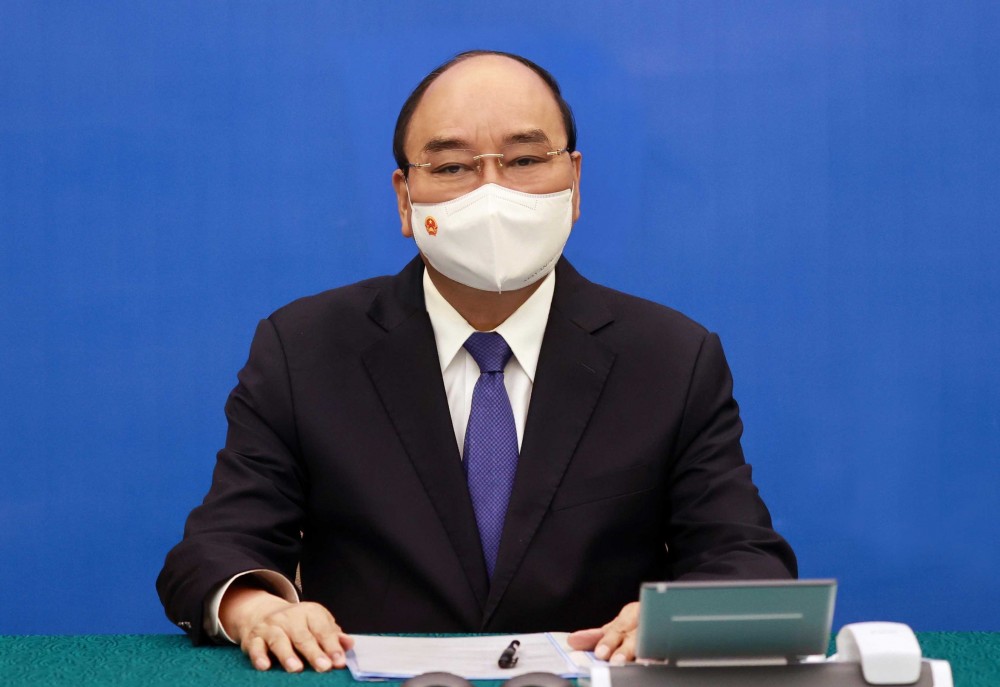 Chủ tịch nước Nguyễn Xuân Phúc điện đàm với Thủ tướng Nhật Bản Yoshihide Suga. (Nguồn: TTXVN)