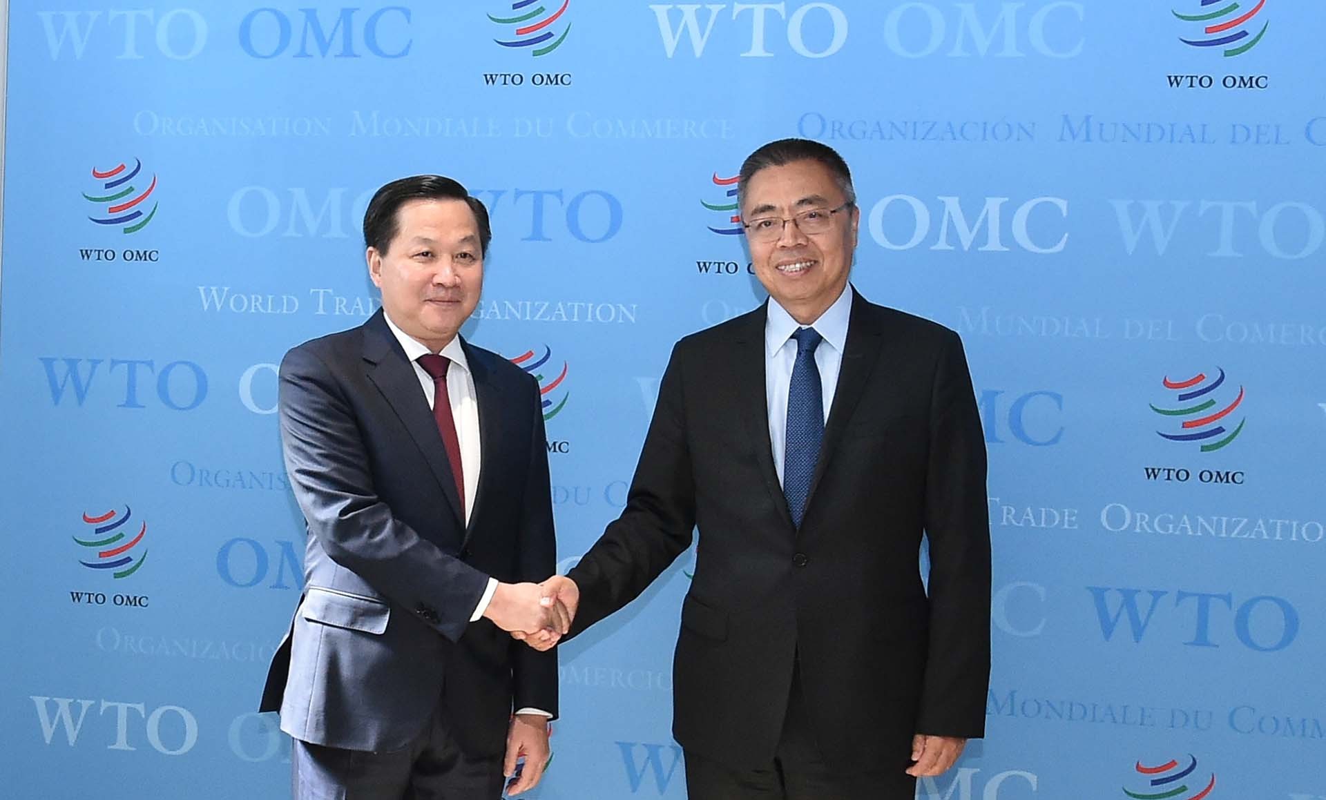 Phó Thủ tướng Lê Minh Khái và Phó Tổng giám đốc WTO Trương Hướng Thần. (Nguồn: VGP) Phó Thủ tướng Lê Minh Khái và Phó Tổng giám đốc WTO Trương Hướng Thần. (Nguồn: VGP)