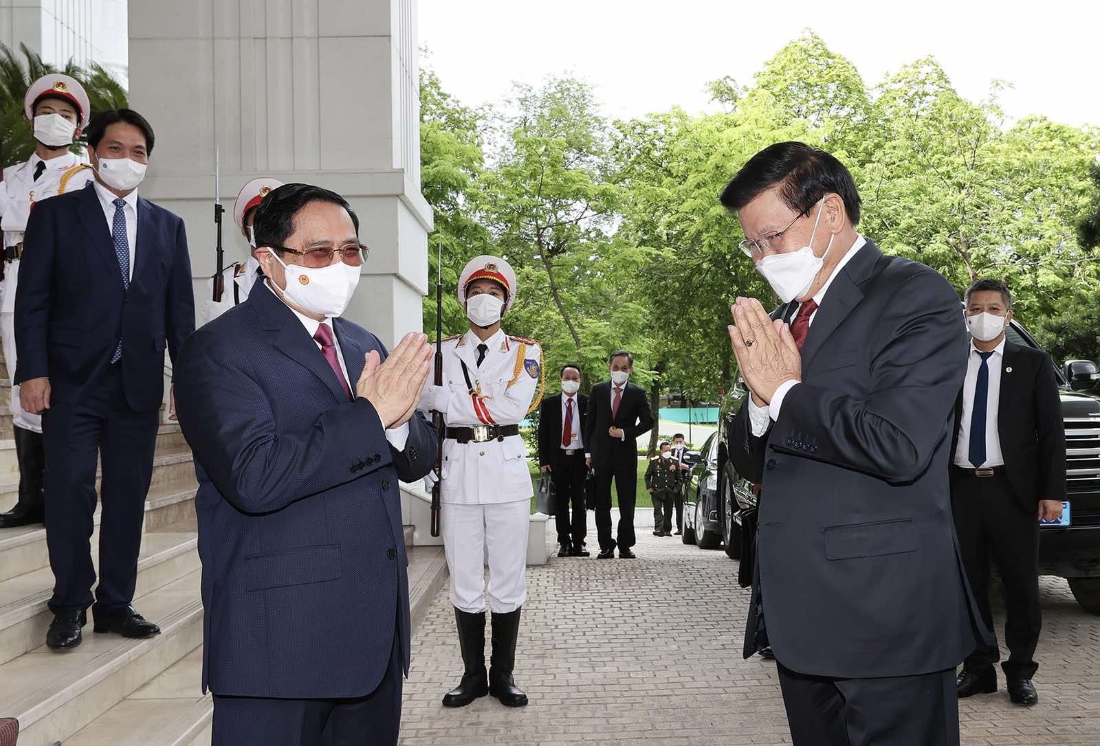 Thủ tướng Chính phủ Phạm Minh Chính đón Tổng Bí thư, Chủ tịch nước Lào Thongloun Sisoulith. Thủ tướng Chính phủ Phạm Minh Chính đón Tổng Bí thư, Chủ tịch nước Lào Thongloun Sisoulith.