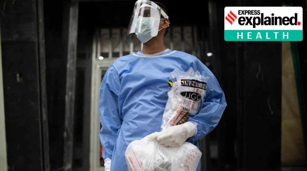 A medical worker holds bags containing chloroquine, azithromycin, dexamethasone to treat patients who tested positive for the new coronavirus in Caracas, Venezuela, August 25, 2020. (AP Photo: Ariana Cubillos) 3346-steroid