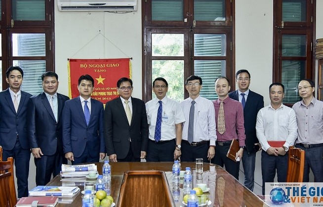 Đoàn Vụ Báo chí Lào thăm, làm việc với Báo Thế giới & Việt Nam