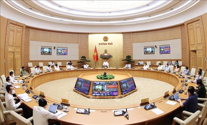 Quang cảnh cuộc họp trực tuyến tại trụ sở Chính phủ. (Nguồn: TTXVN)