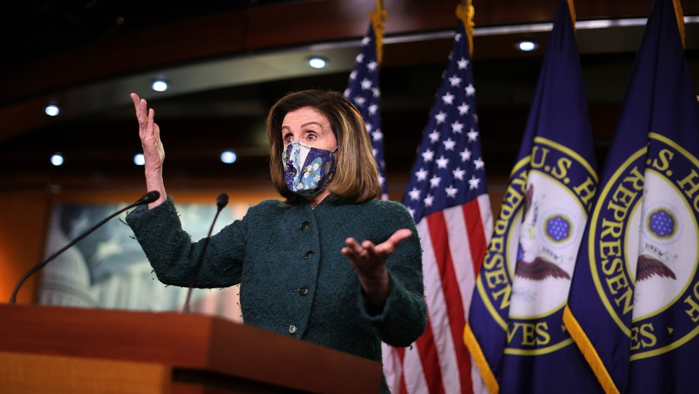 Ảnh ấn tượng tuần (25-31/1): Chủ tịch Hạ viện Mỹ ám chỉ ‘kẻ thù từ bên trong’, chuyến thăm Đồi Capitol và nỗi đau 'sóng thần' Covid-19